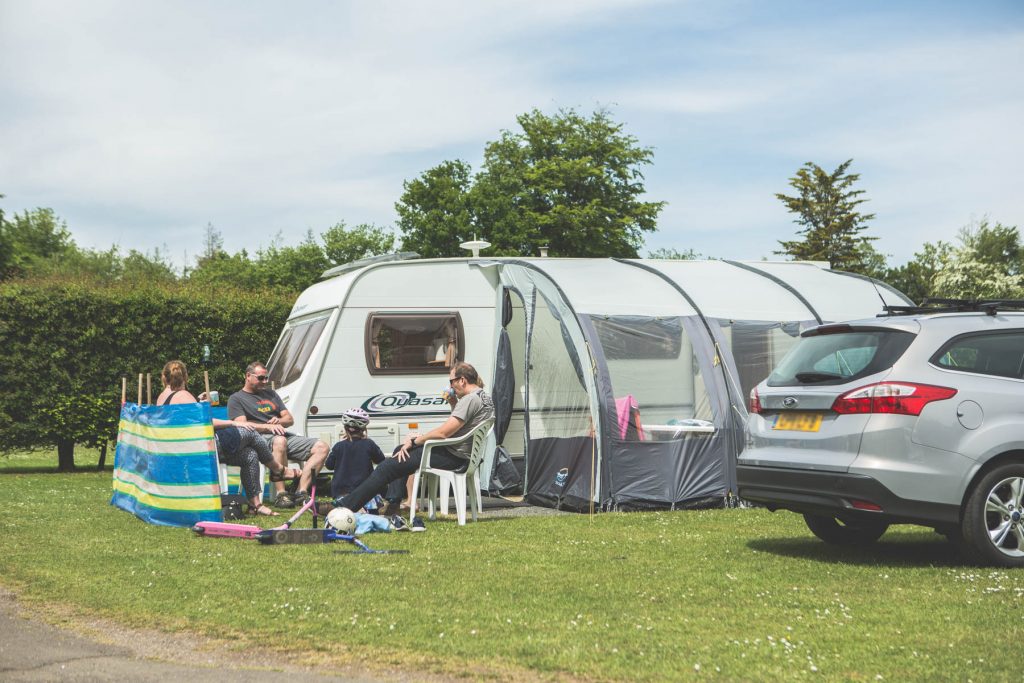 family enjoying camping tent holiday at Forest Glade