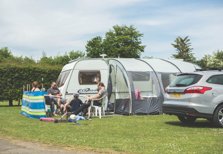 family enjoying camping tent holiday at Forest Glade