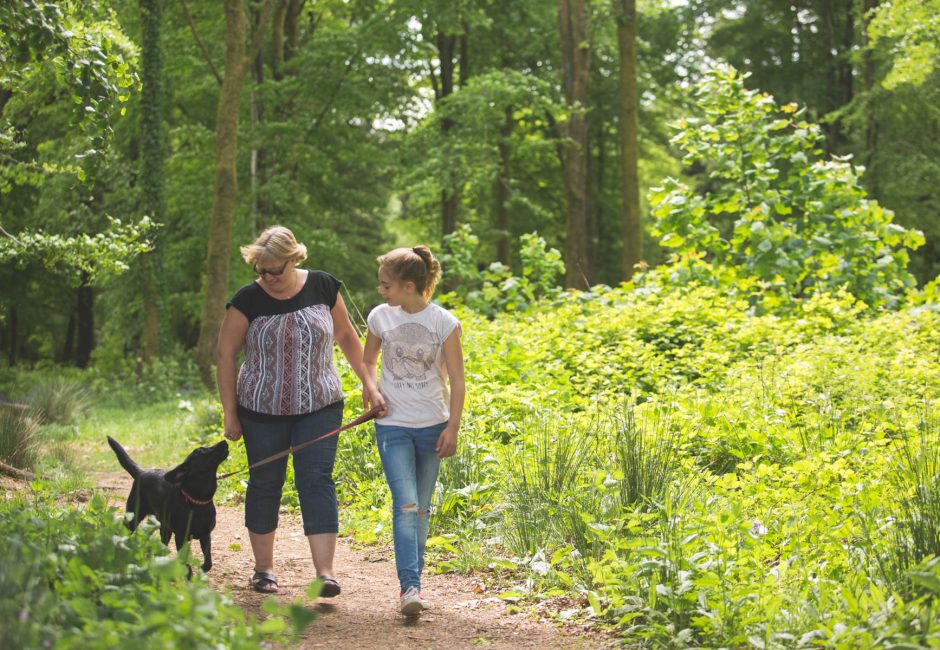 mum and daughter on woodland dog walk at Forest Glade