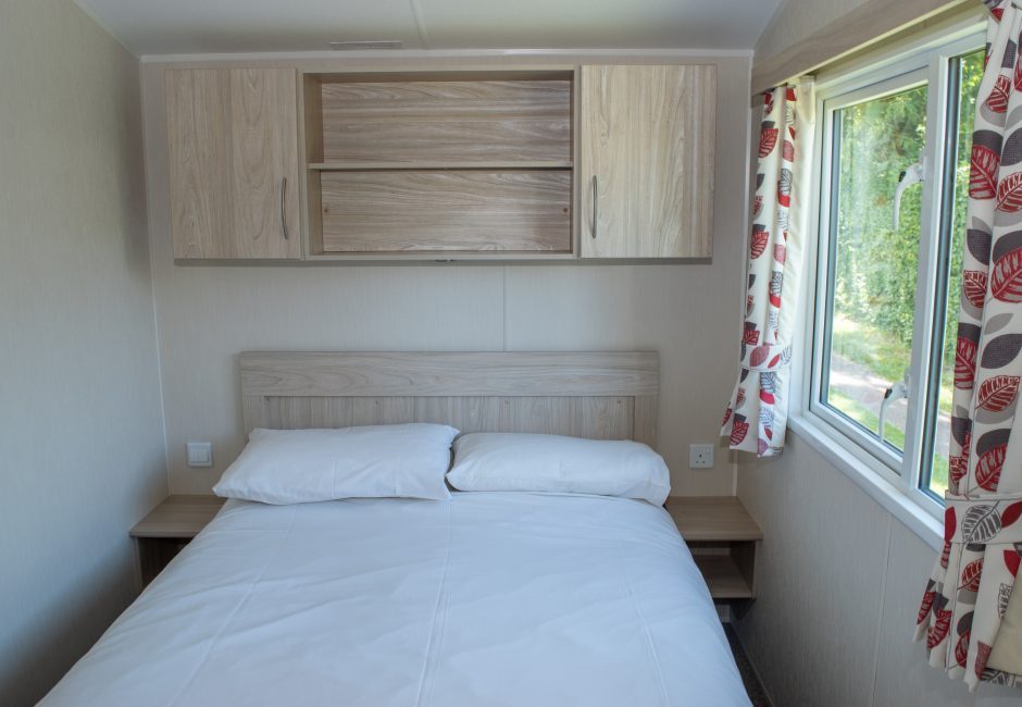 culm caravan bedroom in forest glade holiday park