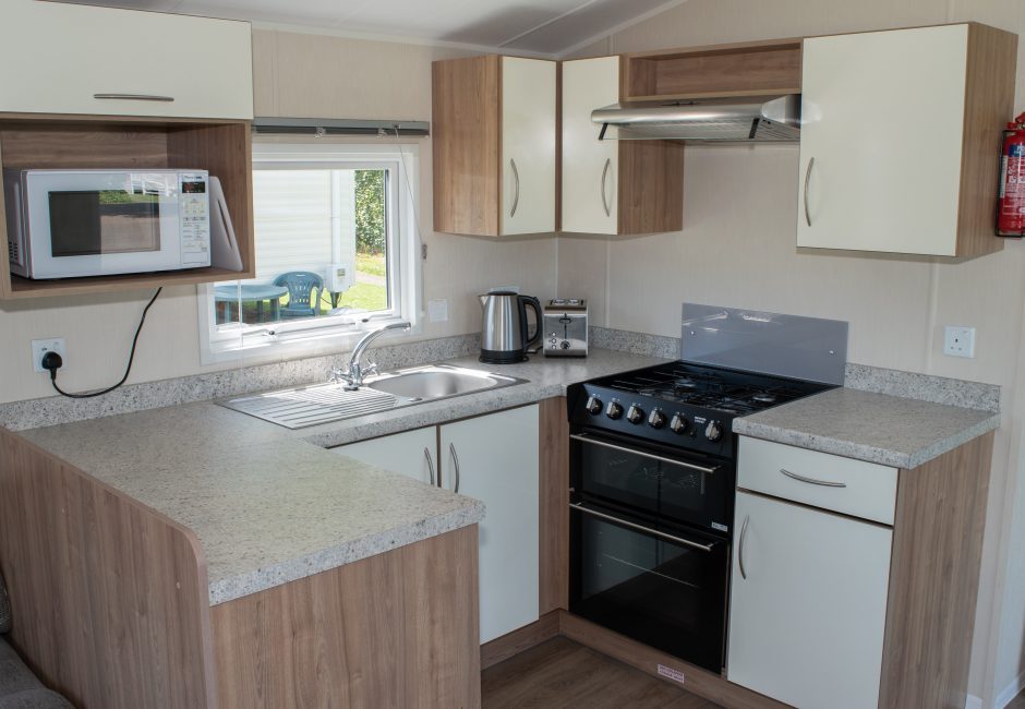 kitchen at culm caravan at forest glade holiday park in cullompton